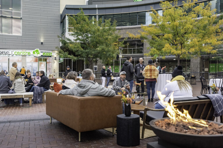 People hanging out outside of the Boise Centre