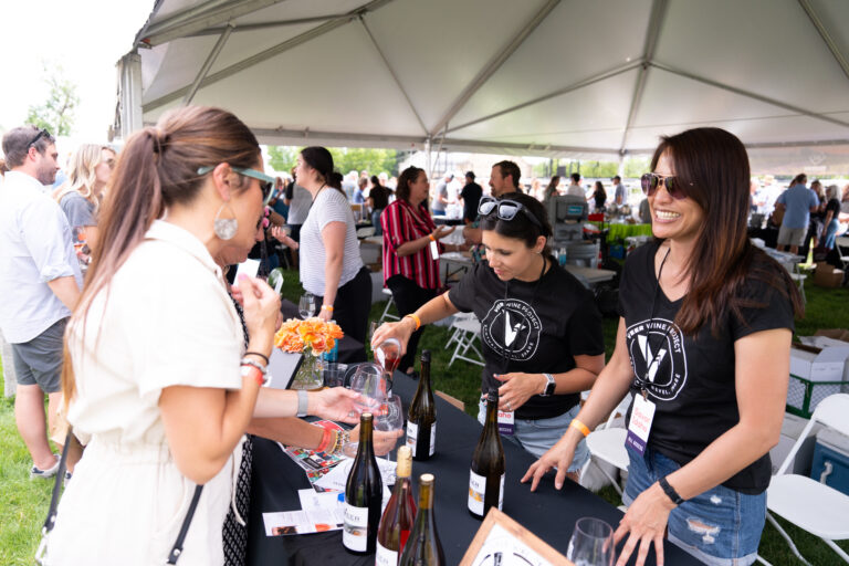 women serving wine at Savor Idaho, a wine festival in Boise, Idaho