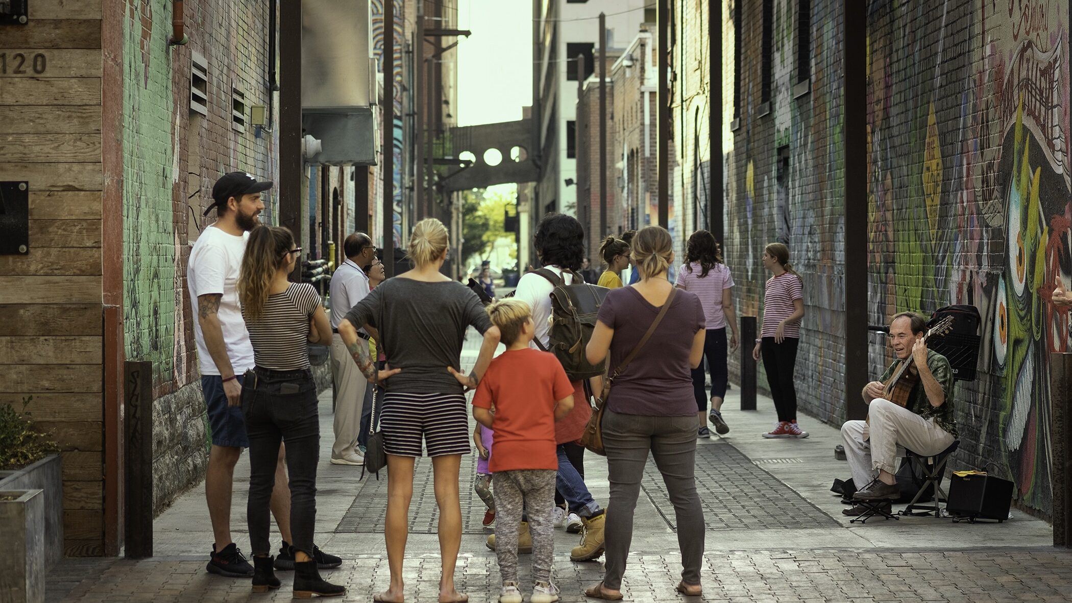 People walking around Freak Alley