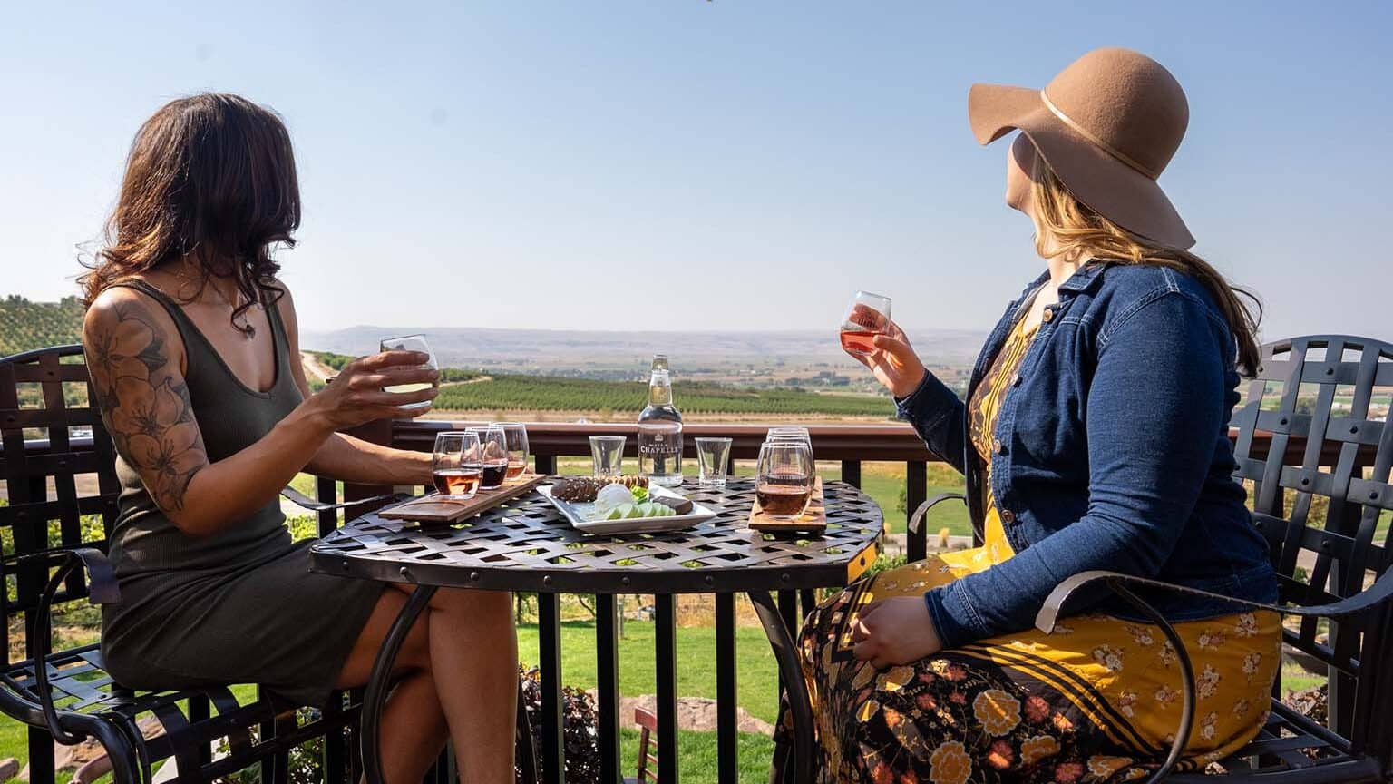 fullimage Two people tasting wine and enjoying the view